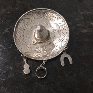 Intricate Silver Brooch with Charms